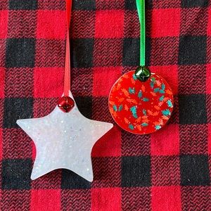 Pair of handcrafted resin decorations